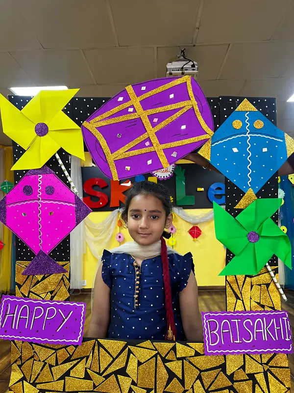 A girl smiling inside the Happy Baisakhi photo frame