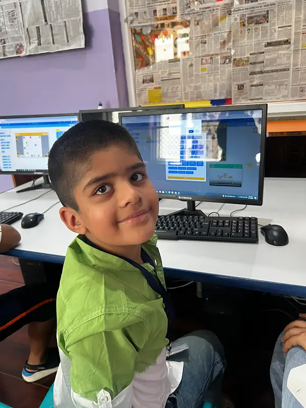 A boy learning on the computer at summer camp