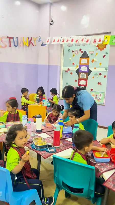 Children eating lunch together at their classroom tables