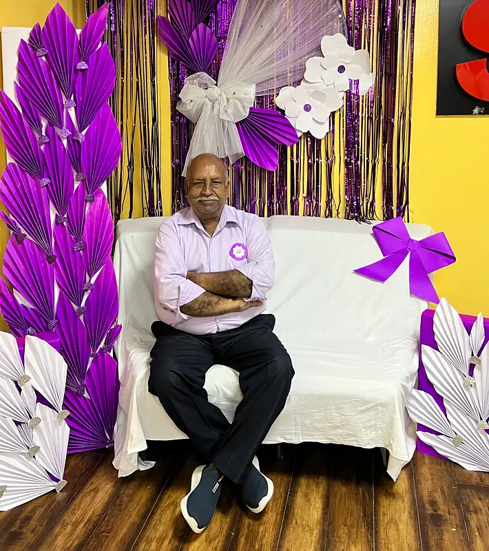 Grandparents at the purple flower booth on Grandparents Day
