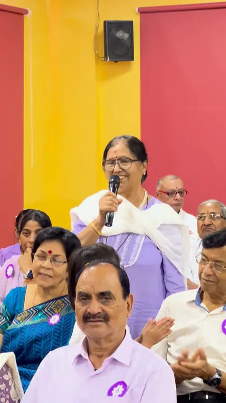 A grandmother speaks to the hall