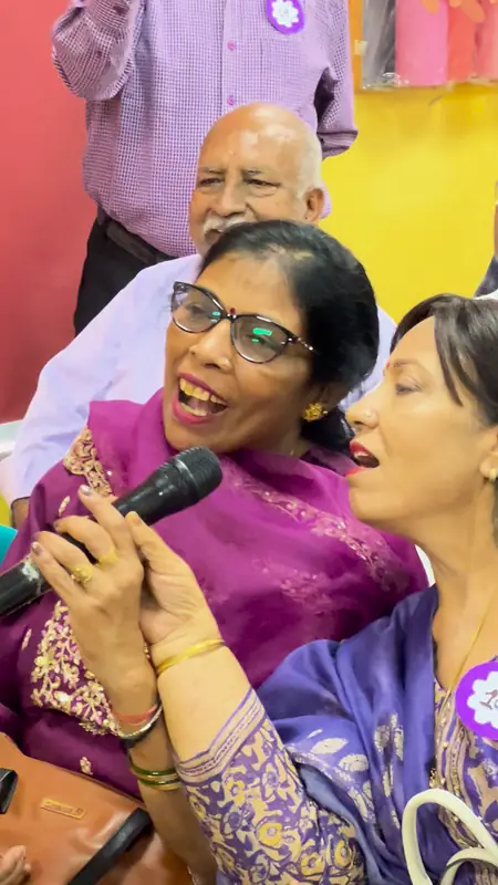 Grandmothers sing together from the audience