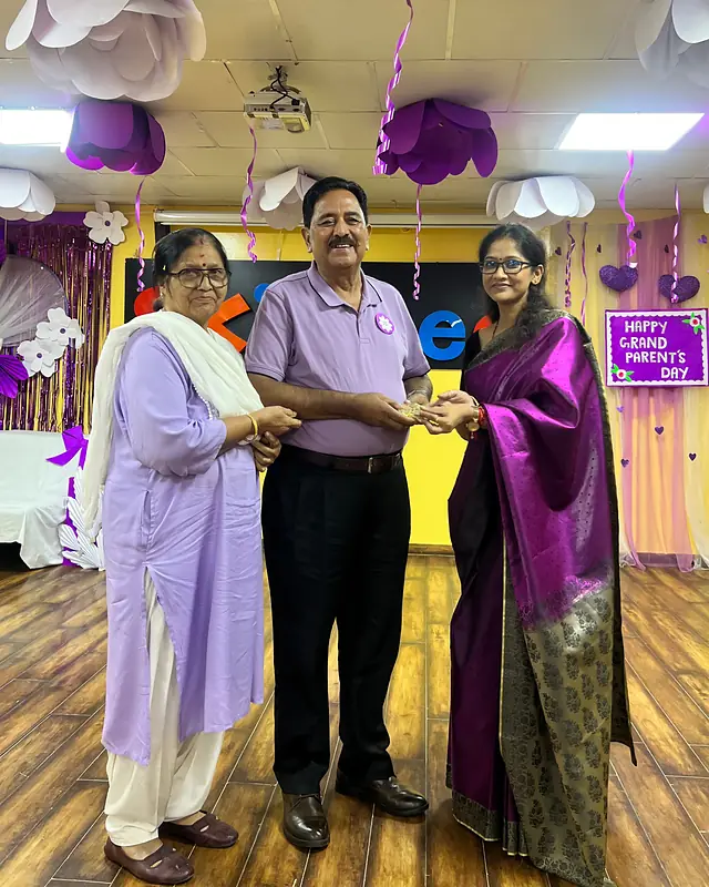 Grandparents receive a trophy together